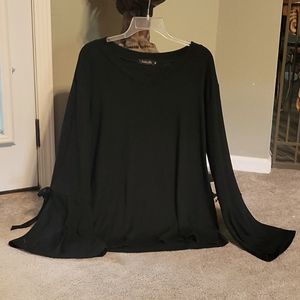 Black sweater, bell sleeves with ties.